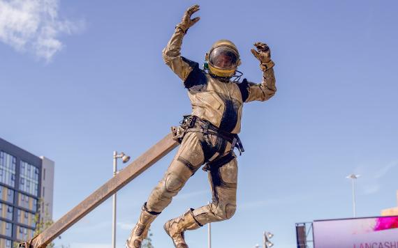 An astronaut leaps into the air 