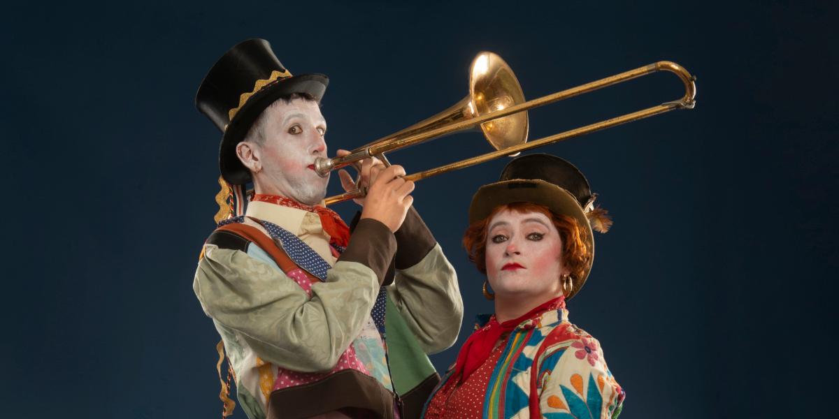 Betty Brown Bags performers in eccentric outfits and one playing a trombone