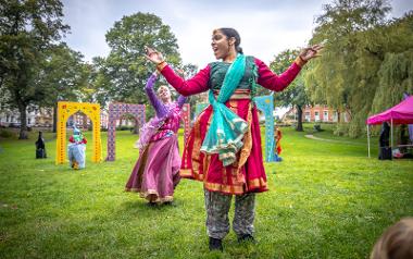 Two performers dancing as part of the Mughal Miniatures Animal Paradise show