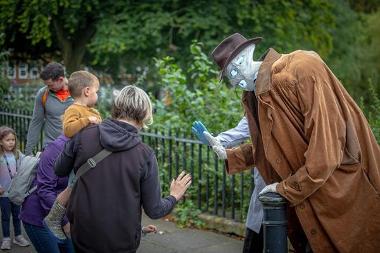 The Invisable Man, giving a family a high five