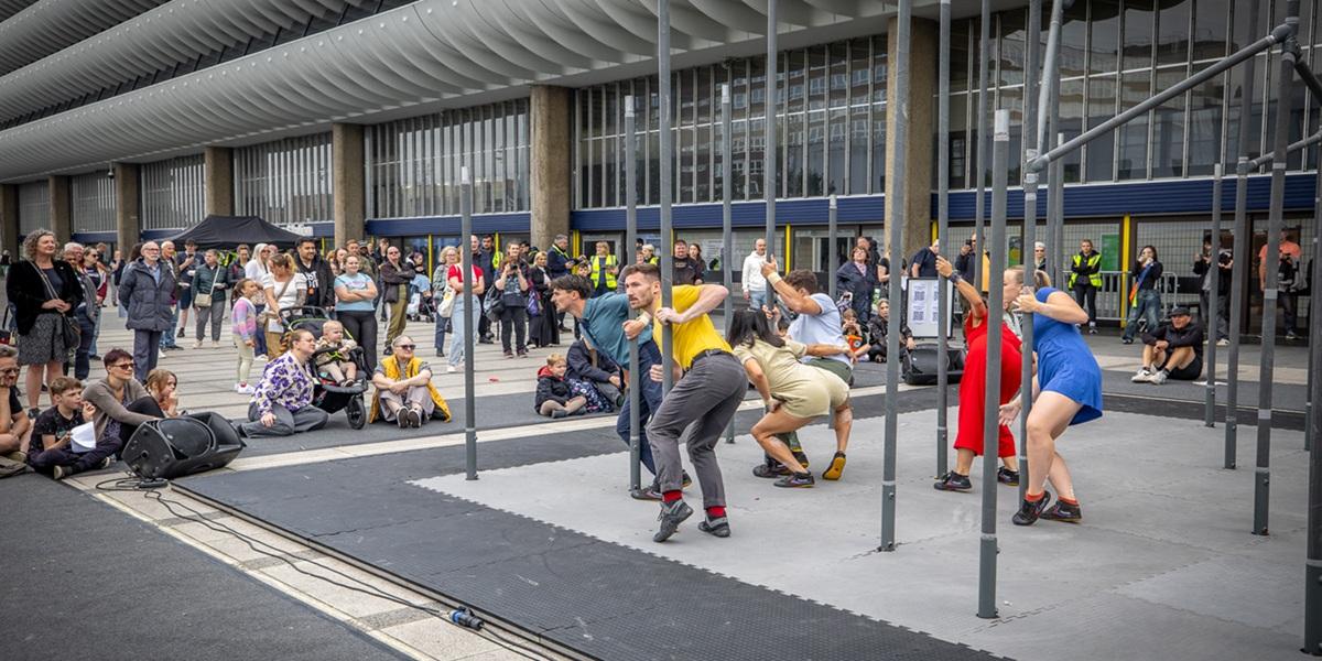 An act called Wild performing in front of Preston Bus Station at the 2024 Encounter Festival