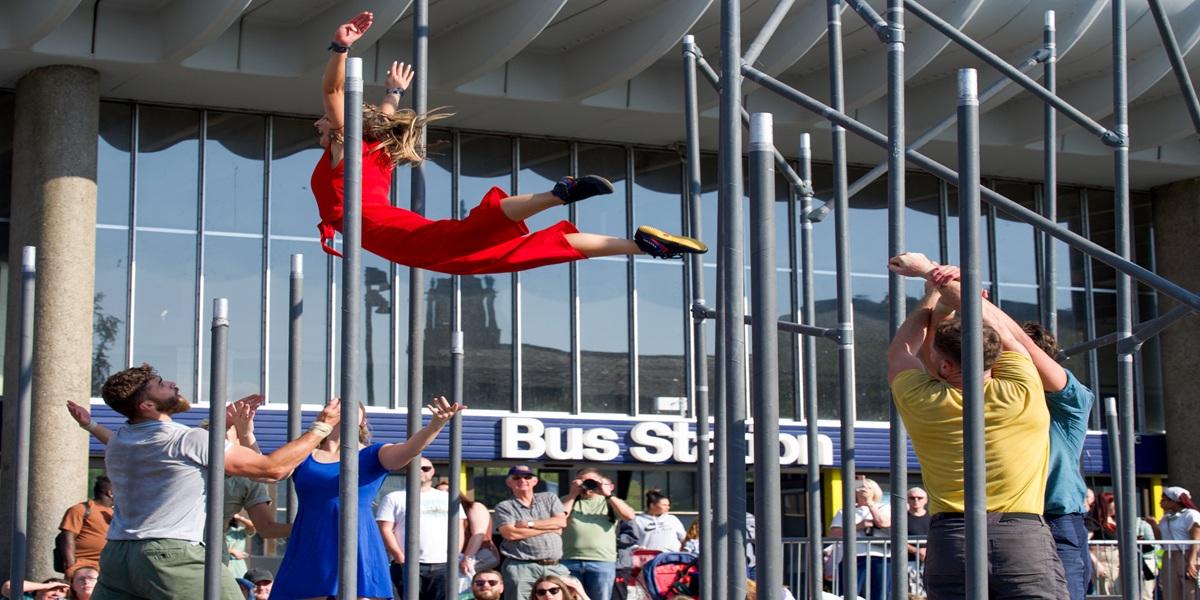 A lady flying through the air at the Encounter Festival 2024