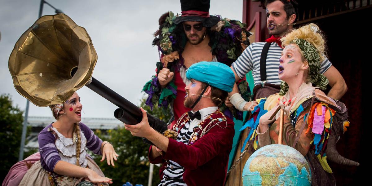 Main image: Play on Market Square Actors in bohemian dress performing for Lancs Encouner on Preston Flag Market.