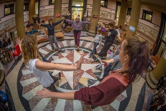 Group of women in a circle inside the Harris' rotunda.