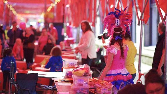 Craft tables inside Lancashire Encounter's long red tent.