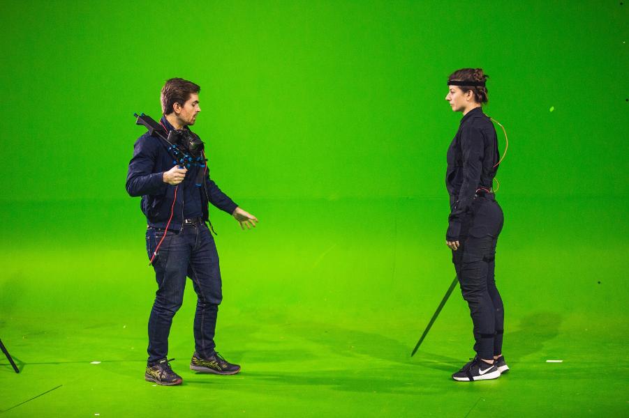 A man and won acting on a green screen 